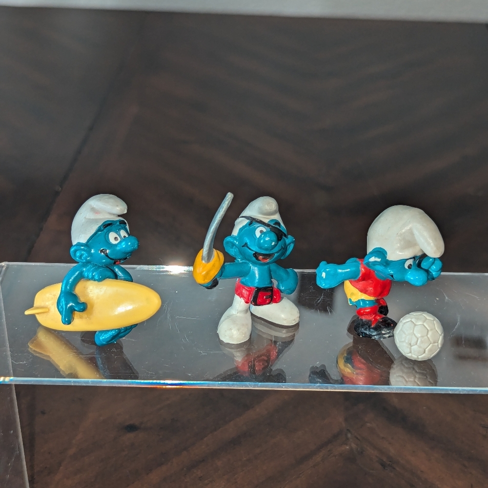 Smurf Pirate Soccer and Surfer figurines.